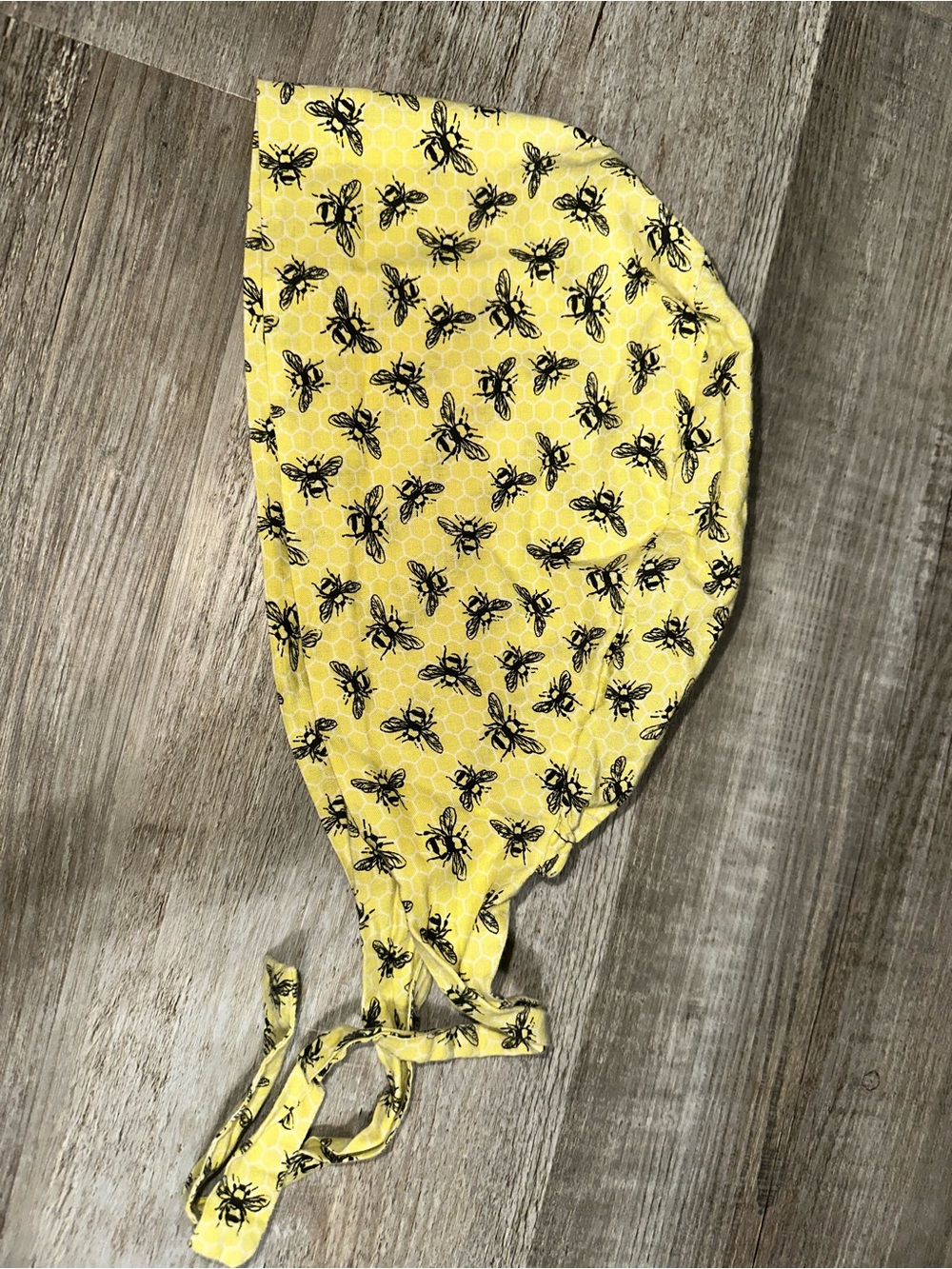Yellow and black bee tie-back surgical cap